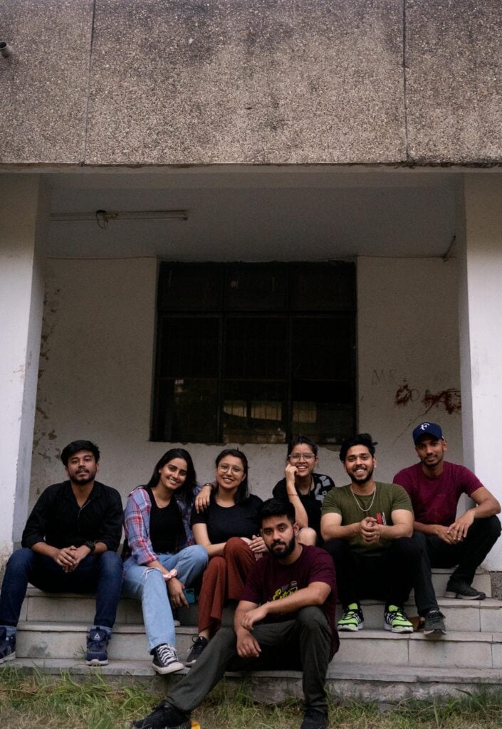 pexels-madvortex-12807377 Group of Indian GenZ friends sitting together